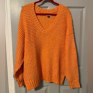 Size L bright orange sweater. American Eagle. Brand New no tags.